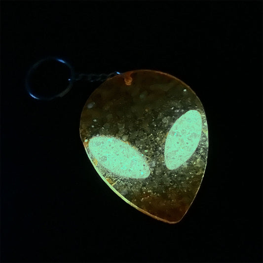 Lees Art Studio chunky glitter glow in the dark alien head resin keychain glowing view