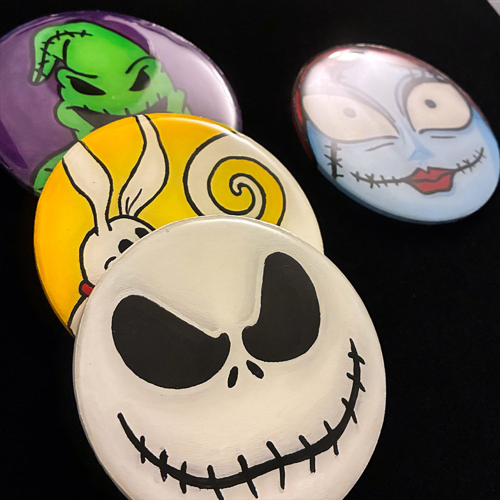 Four Halloween-themed coasters featuring characters of Nightmare Before Christmas with a black background