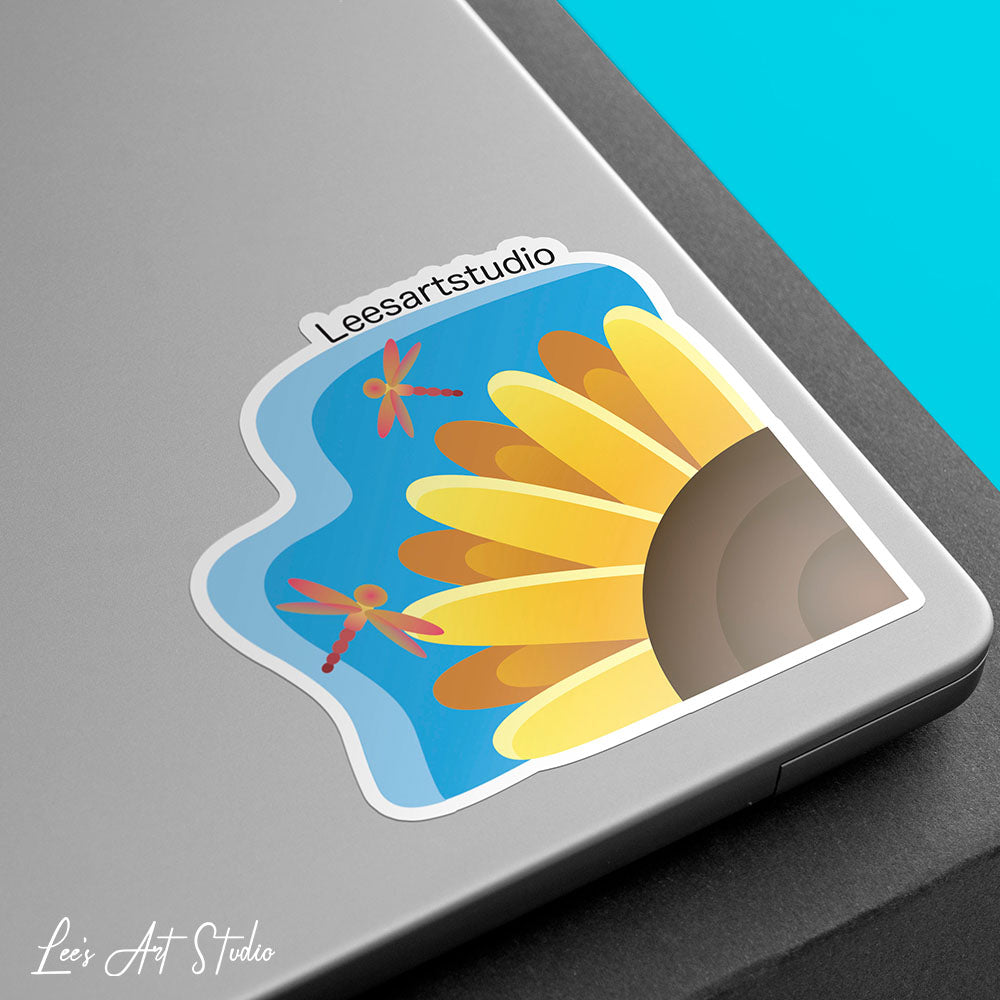 Lee's Art Studio mockup of a premium sticker with dragonflies and sunflowers united harmoniously on a perfect summer day on a laptop border.