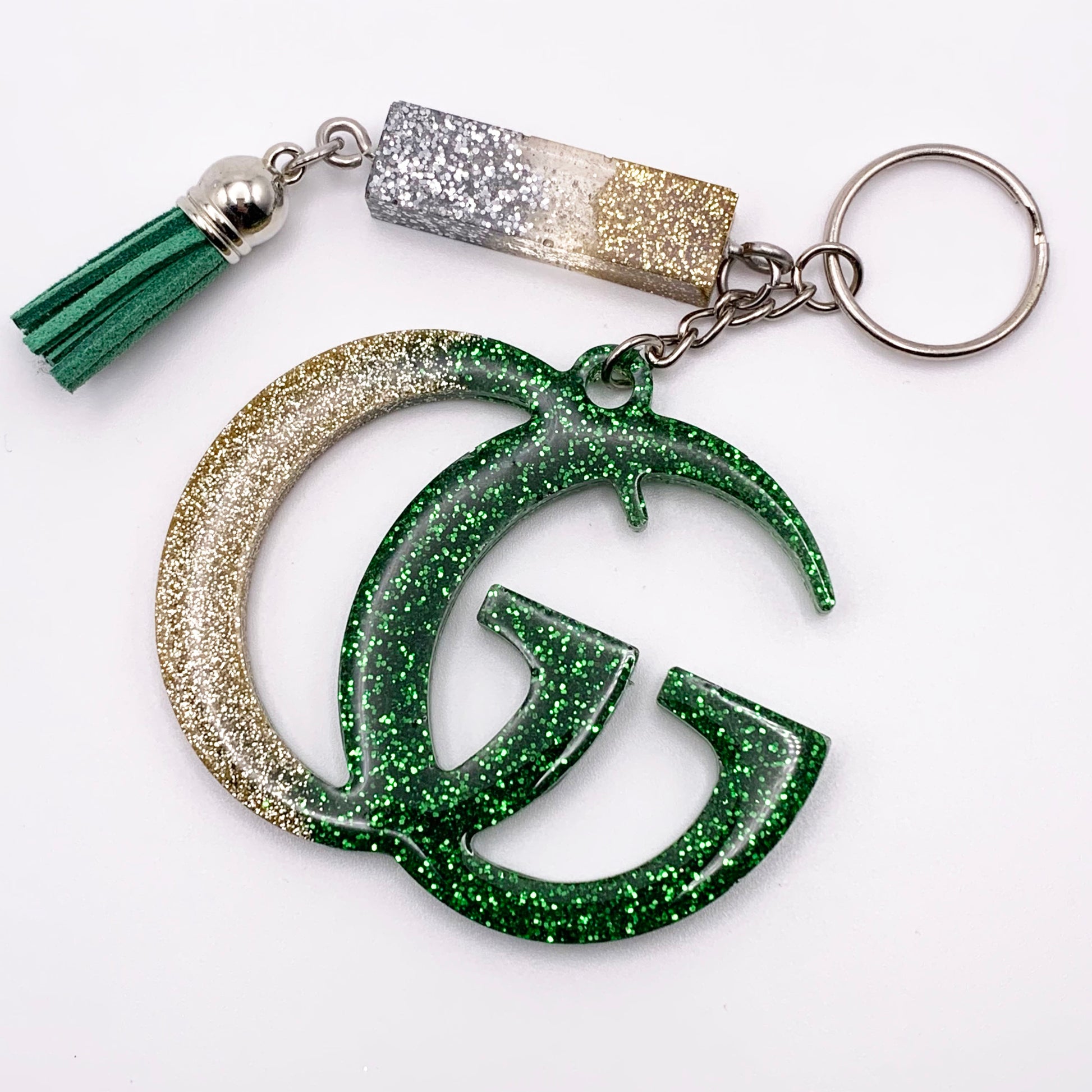 Lee's Art Studio fashion statement resin keychain with silver, gold and green glitter and green tassel