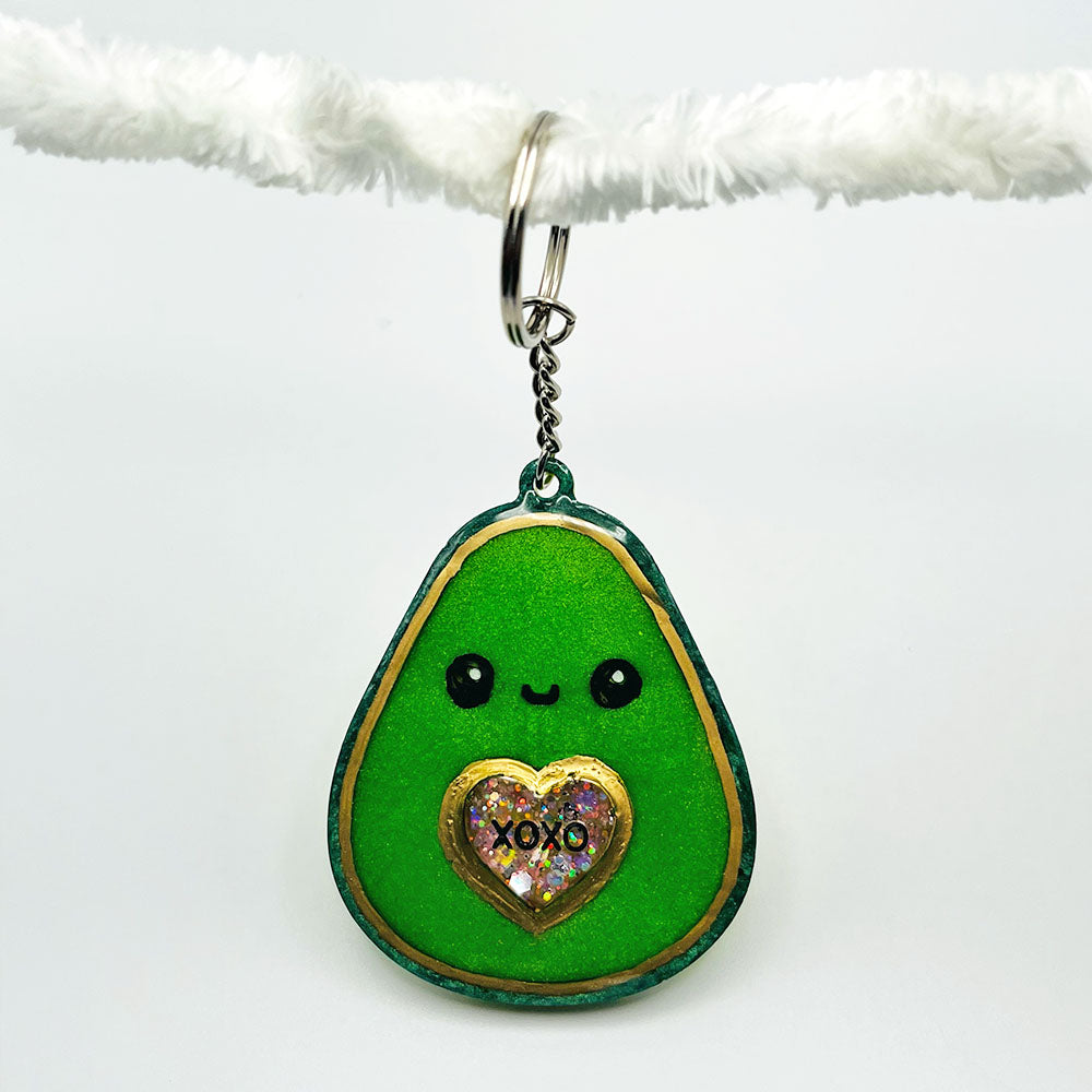 Lees Art Studio avocado with pink chunky glitter xoxo heart resin keychain